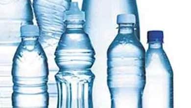 Variety of clear water bottles of different sizes on a white background