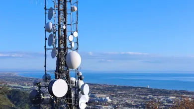 cell tower over looking skyline