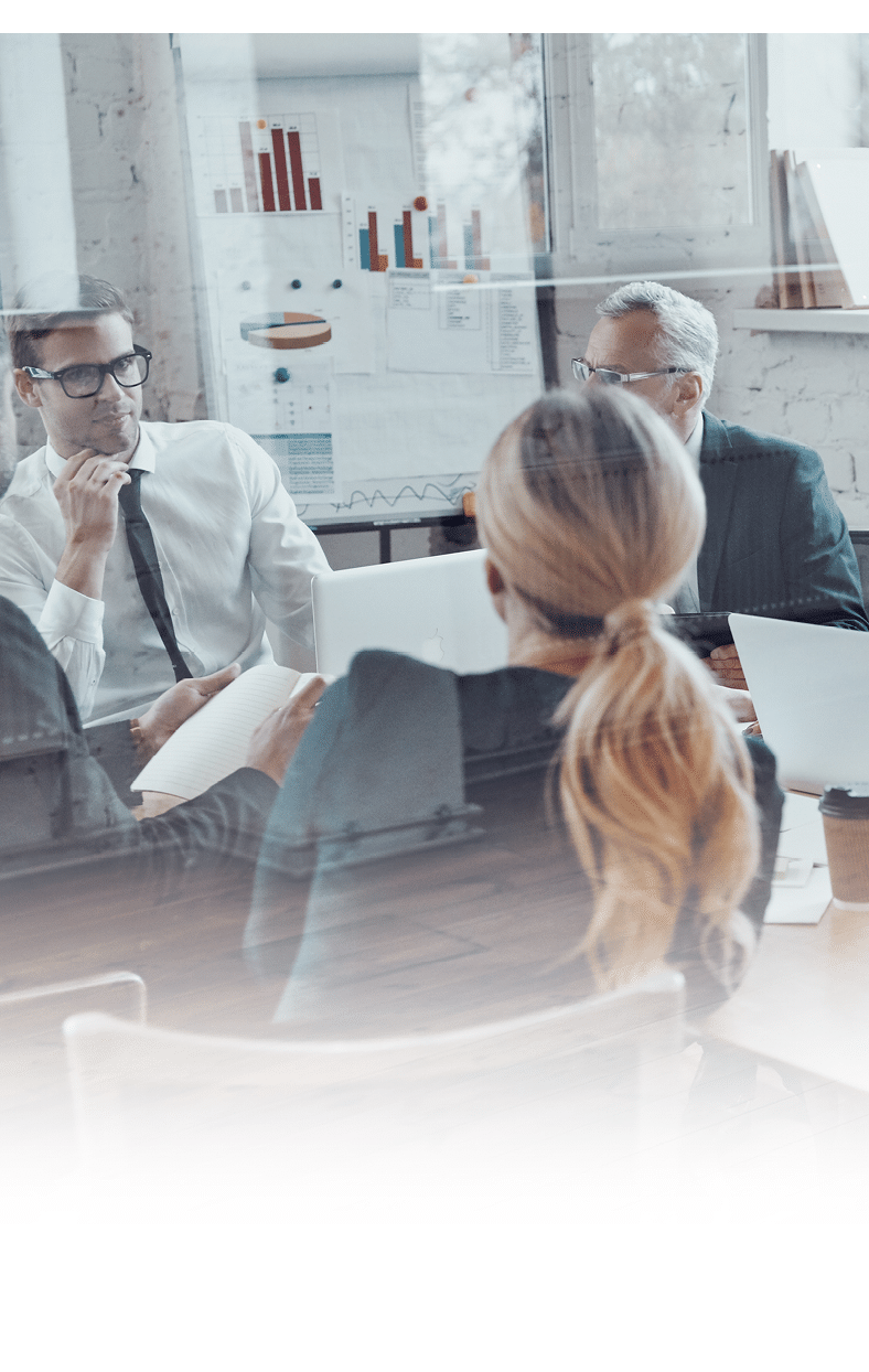 Successful business team discussing strategy while filming staff meeting in the board room