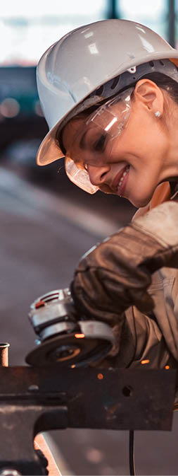 Beautiful woman working at heavy industry factory.